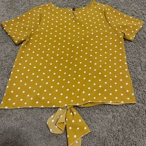 A yellow doted shirt